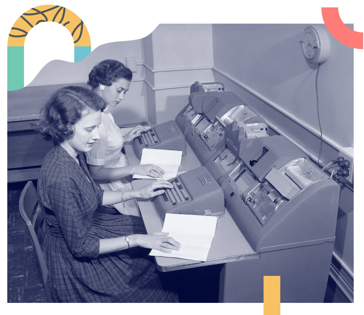 A vintage room of women working in early technology desks