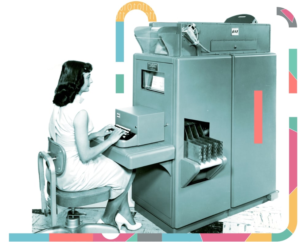 A duotone image of a woman typing on a large vintage computer